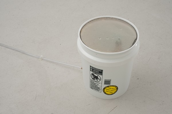 Egan Frantz, Pierre Gimonnet & Fils blanc de blancs bubbles no. 1, 2012Artist's champagne bottle, pvc bucket, pvc hose, aluminum composite ring with pigmented cheesecloth, electric air pump, brass conduit and distilled water. Dimensions variable Egan Frantz, Pierre Gimonnet & Fils blanc de blancs bubbles no. 1, 2012<br class=